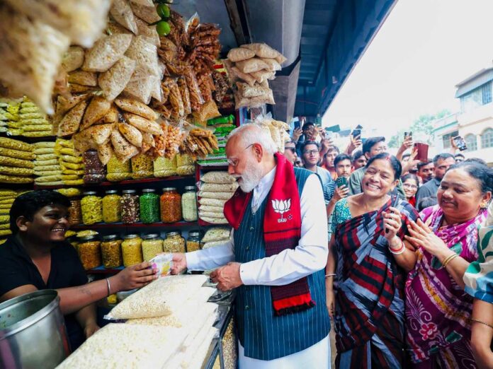 Jhargram: PM Modi Stops for Jhalmuri During Bengal Campaign (Photo- IANS)