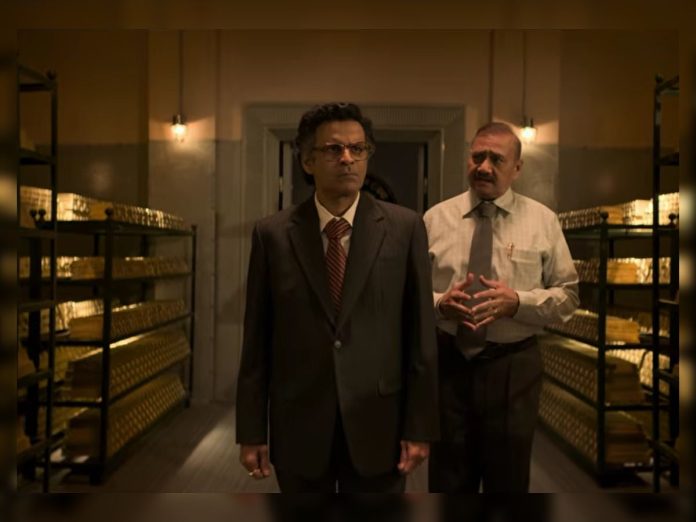 Two men in business attire stand in a dim archive room lined with shelves of gold bars.