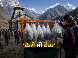 Hanging clear plastic bags filled with trash on a rack in front of a temple, with snowy mountains in the background and a woman with a backpack on the right.