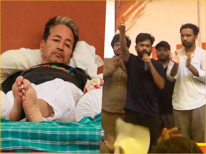 Split image: left side shows a man lying in bed with feet visible; right side shows a man with a microphone addressing a crowd on a stage as others applaud nearby.