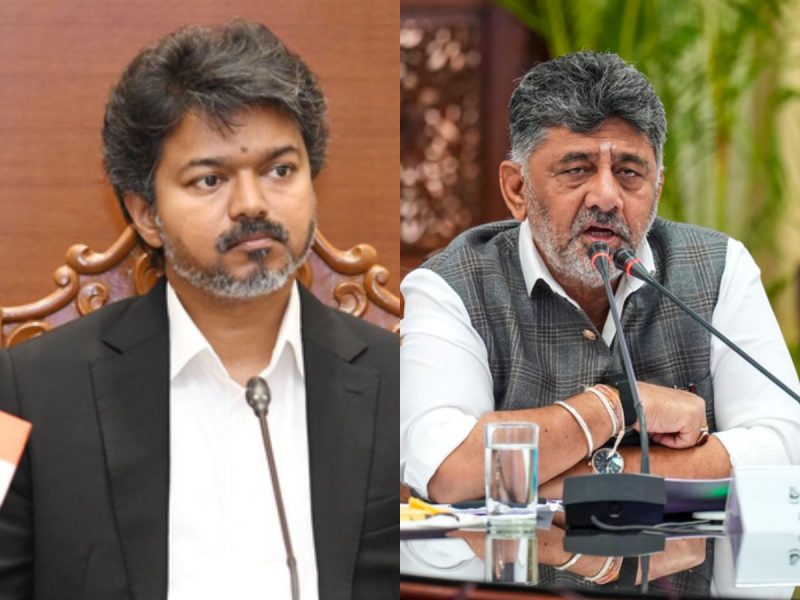 vijay government move to supreme court against karnataka regarding kaveri water dispute - bolebharat Split image of two men in a formal meeting: left man in a black suit listening, right man in a checked vest speaking into a microphone at a panel.